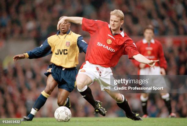 Davd May of Manchester United and Ian Wright of Arsenal battle for the ball during an FA Carling Premiership match at Old Trafford on November 16,...