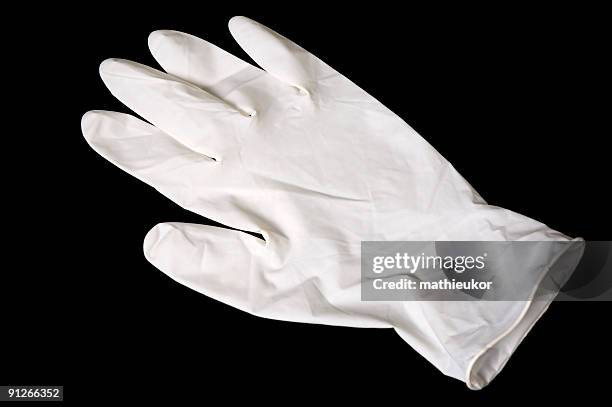 latex glove isolated on black - latex 個照片及圖片檔