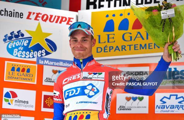 Team's French cyclist Marc Sarreau celebrates on the podium after winning the 162 km first stage of the 48th edition of the Etoile de Besseges...