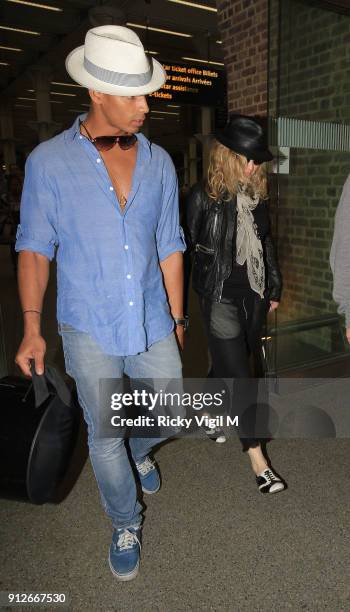 Madonna arrives at St Pancras International station with her boyfriend, Brahim Zaibat on June 26, 2011 in London, England.