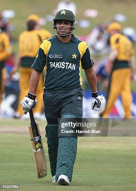 Kamran Akmal of Pakistan leaves the field after being dismissed during the ICC Champions Trophy Group A match between Australia and Pakistan played...