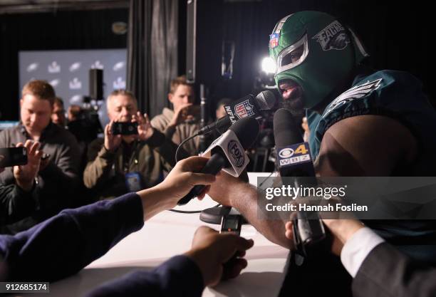 Fletcher Cox of the Philadelphia Eagles wears a mask as he speaks to the media during Super Bowl LII media availability on January 31, 2018 at Mall...