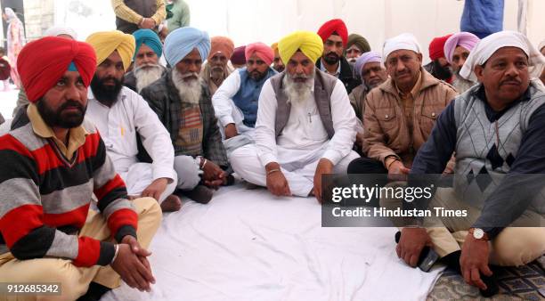 Maur AAP MLA Jagdev Singh Kamalu sitting in bhog of path to mark anniversary of Maur bomb blasts on January 31, 2018 in Maur, India. Residents of...