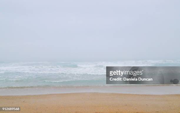 foggy beach - wrightsville stock pictures, royalty-free photos & images