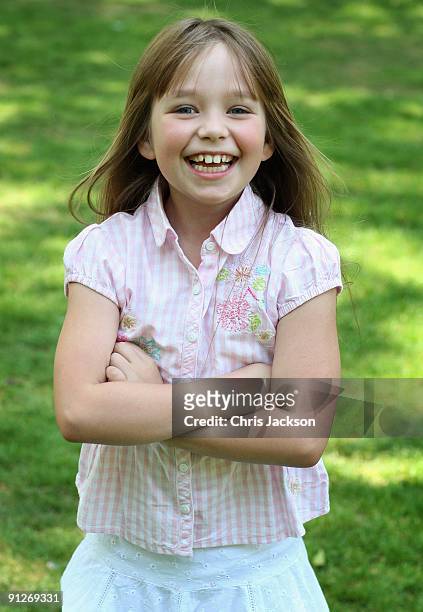 Singer Connie Talbot lies on the grass as she takes part in a photoshoot at London Zoo on June 25, 2009 in London, England.