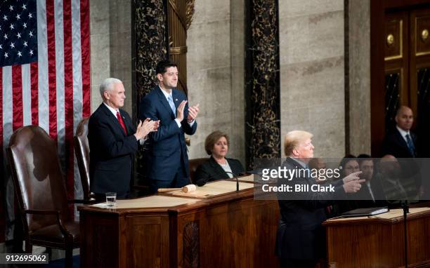 From left, Vice President Mike Pence and Speaker of the House Paul Ryan, R-Wisc., clap as President Donald Trump delivers his State of the Union...