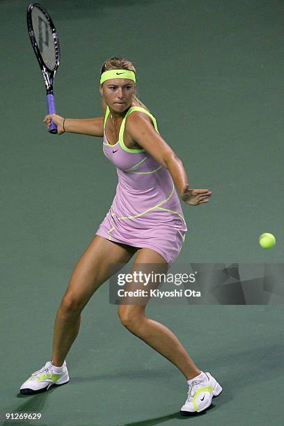 Maria Sharapova of Russia returns a shot in her match against Alisa Kleybanova of Russia on day four of the Toray Pan Pacific Open Tennis tournament...