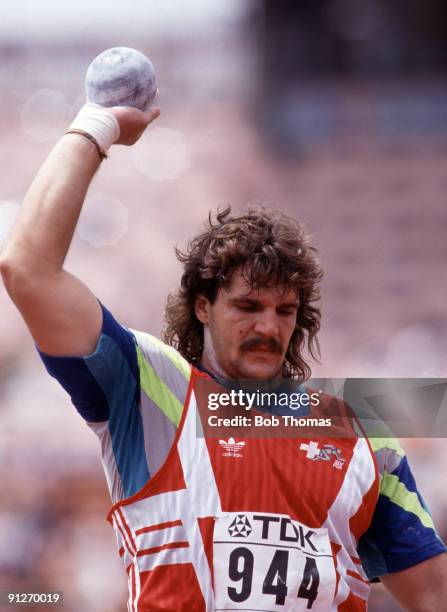 Werner Gunther of Switzerland, gold medallist, prepares to put the shot at the 3rd World Athletics Championships held at the Olympic Stadium in...