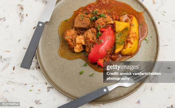 served lamb stew with bell pepper. - lamb stew stock pictures, royalty-free photos & images