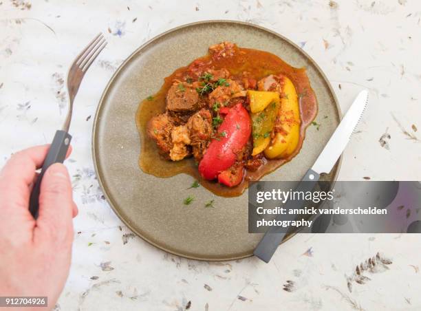 served lamb stew with bell pepper. - simmer on the bay stock pictures, royalty-free photos & images