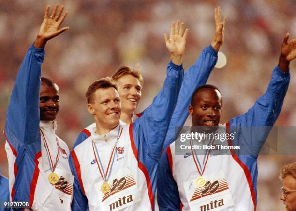 Kriss Akabuki, Paul Sanders, Roger Black and John Regis of Great Britain, gold medallists in the men's 4x400m relay, at the 15th European Athletics...