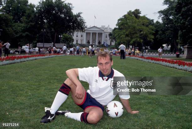 David Platt of England wearing his football kit sits on the grass in front of the White House during the team's tour to Washington DC, USA in June...