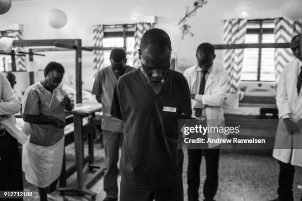 Hospital staff pray to start the day at Cure Hospital on February 6, 2017 in Mbale, Uganda. Sub-Saharan Africa has only one neurosurgeon for every 10...