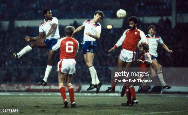 Alvin Martin of England heads the ball towards the goal during the England v Wales British Championship match played at Wembley Stadium on the 23rd...