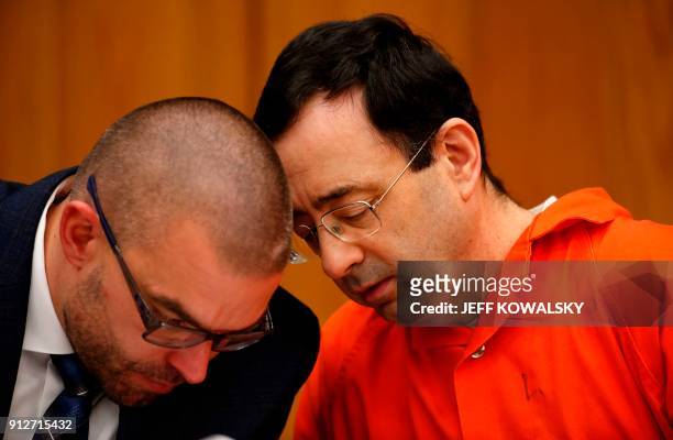 Former Michigan State University and USA Gymnastics doctor Larry Nassar with his defense attorney Matt Newberg during the sentencing phase in Eaton,...