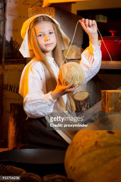 cinderella near fireplace working in kitchen - latvia girls stock pictures, royalty-free photos & images