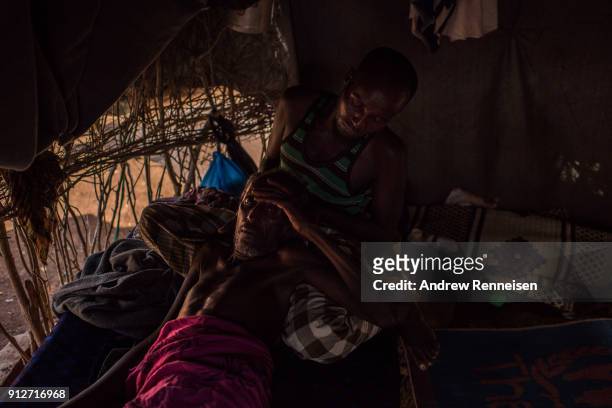 Osman Hasan Yare, about 70, is cared for by a relative at Tawwakul 2 Diinsoor in Baidoa, Somalia. Yare came to the camp of close to 155,000 people...