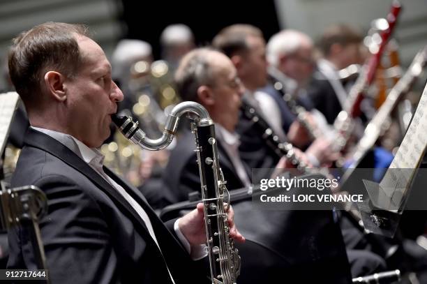 Musician of the Ural Philharmonic Orchestra playing the bass clarinet, takes part in a rehearsal of a musical piece composed by Russian composer...