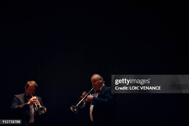 Musicians of the Ural Philharmonic Orchestra plays the trumpet as they practise backstage prior to perform on stage during the first day of "La Folle...