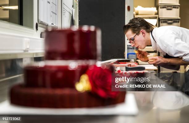 Baker of the bakery Landwaart makes a special birthday cake for Dutch Princess Beatrix on her 80th birthday on January 31 in Maartensdijk. / AFP...