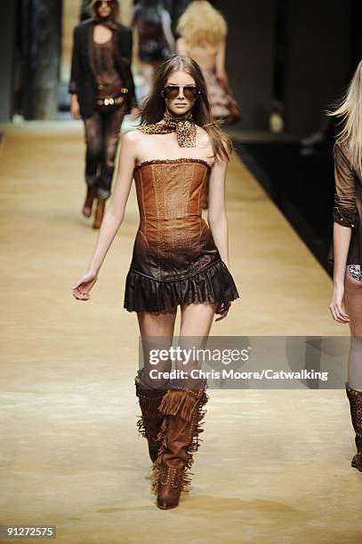 Model walks the runway during the Dolce & Gabbana Spring Summer 2010 Ready To Wear show as part of the Milan Womenswear Fashion Week Spring/Summer...