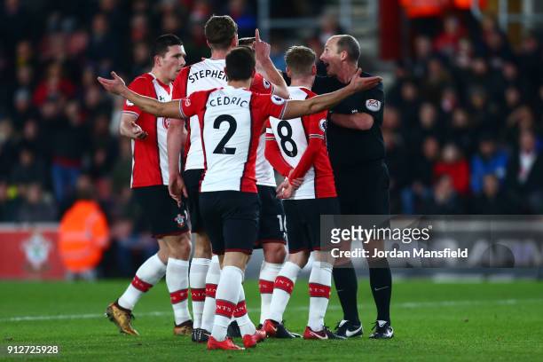 Southampton players protest to referee Mike Dean after conceeding a penalty during the Premier League match between Southampton and Brighton and Hove...
