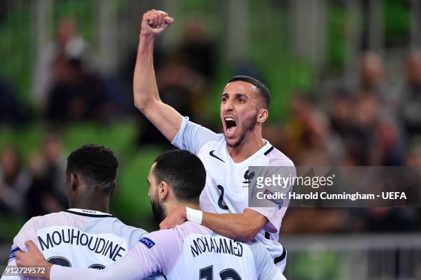 Abdessamad Mohammed of France celebrates with his team mates Souheil Mouhoudine and Azdine Aigoun of France opening the score during the UEFA Futsal...