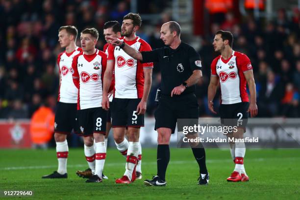 Southampton players protest to referee Mike Dean after conceeding a penalty during the Premier League match between Southampton and Brighton and Hove...