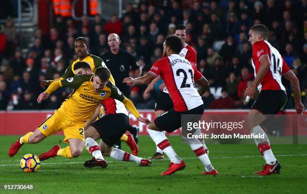 Solly March of Brighton and Hove Albion is fouled by Wesley Hoedt of Southampton, for which a penalty is awarded by referee Mike Dean during the...