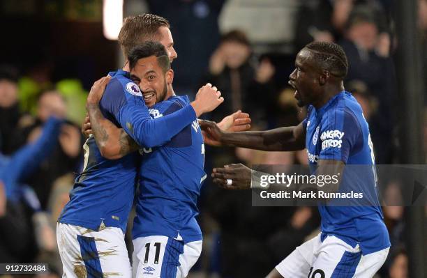 Theo Walcott of Everton celebrates after scoring his sides first goal with Gylfi Sigurdsson of Everton and Oumar Niasse of Everton during the Premier...