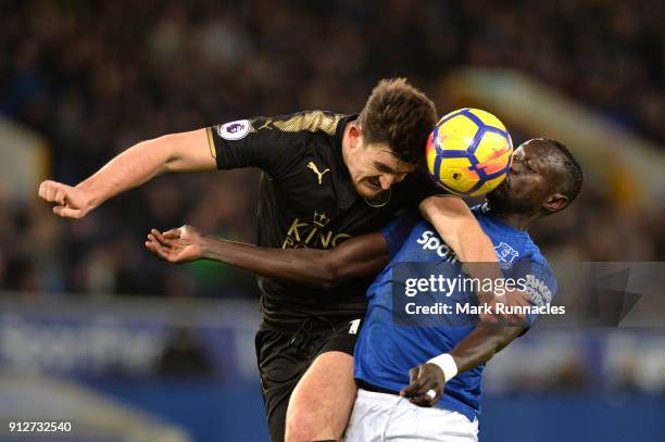 Harry Maguire of Leicester City wins a header over Oumar Niasse of Everton during the Premier League match between Everton and Leicester City at...