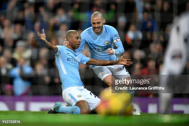 Fernandinho of Manchester City celebrates after scoring his sides first goal with David Silva of Manchester City during the Premier League match...