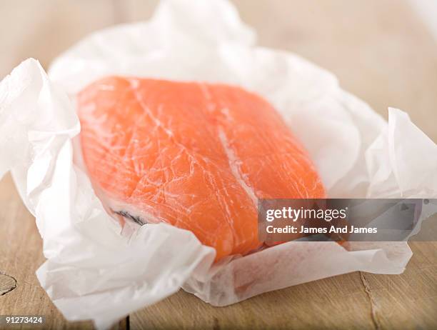 raw salmon in butcher paper - butcher paper stock pictures, royalty-free photos & images