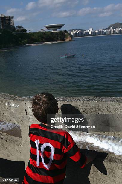 Brazilian youth looks across an inlet in Guanabara Bay towards the Museu de Arte Contemporânea , or the Museum of Contemporary Art, which was...