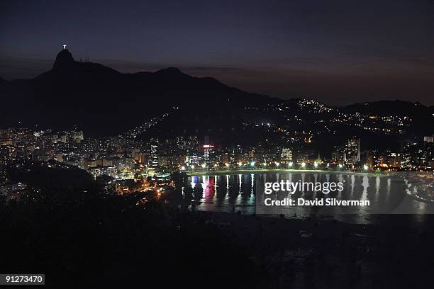 From the top of Pão de Açúcar, or Sugarloaf Mountain, the view of the city at sunset stretches from Corcovado mountain with its iconic Christ the...