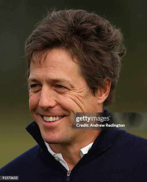 Actor Hugh Grant smiles during the final practice round of The Alfred Dunhill Links Championship at Kingsbarns Golf Links on September 30, 2009 in...