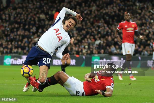 Luis Antonio Valencia of Manchester United brings down Dele Alli of Tottenham Hotspur in the penalty area during the Premier League match between...