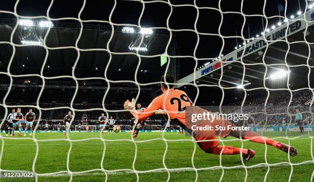 Burnley goalkeeper Nick Pope dives to save the penalty by Newcastle player Joselu during the Premier League match between Newcastle United and...