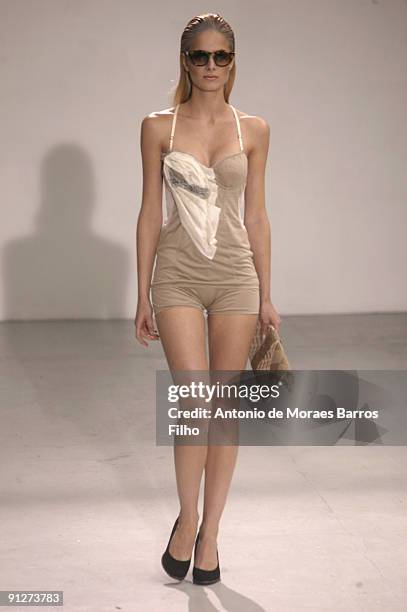 Model walks the runway during the Tim Van Steenbergen Pret a Porter show as part of the Paris Womenswear Fashion Week Spring/Summer 2010 at Espace...