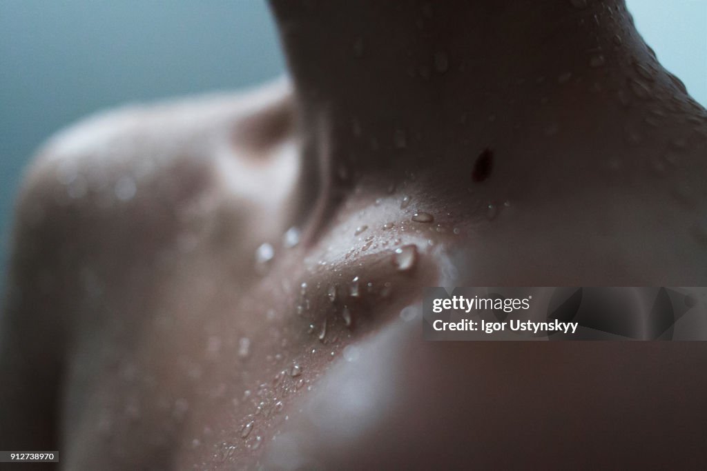 Extreme close-up of woman enjoying a shower