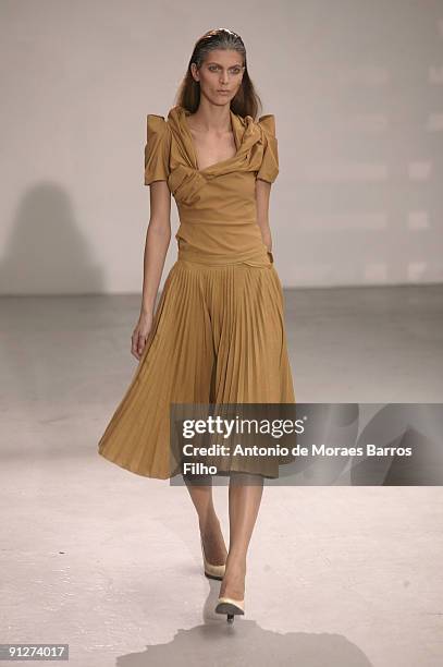 Model walks the runway during the Tim Van Steenbergen Pret a Porter show as part of the Paris Womenswear Fashion Week Spring/Summer 2010 at Espace...