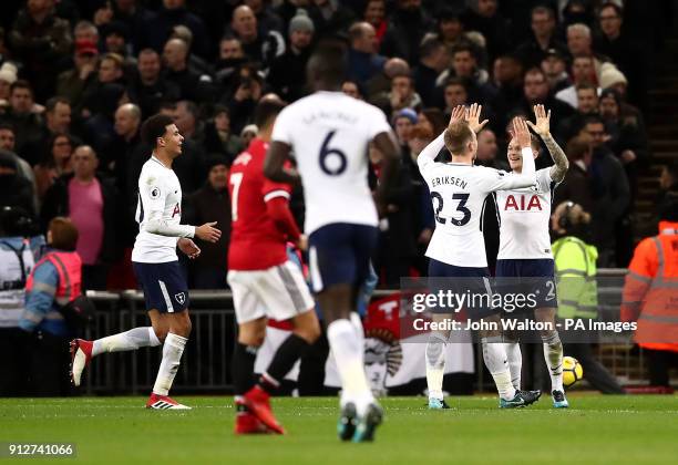 Tottenham Hotspur's Christian Eriksen and Kieran Trippier celebrate their sides second goal of the game after Manchester United's Phil Jones scores...