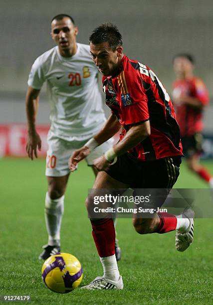Dejan Damjanovic of Seoul in action against Jawad Ahannach of Umm-Salal during the AFC Champions League match between FC Seoul and Umm-Salal at Seoul...