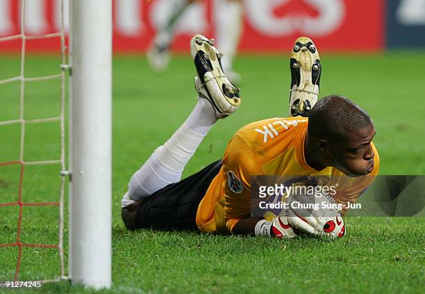 Goalkeeper Baba Malick of Umm-Salal saves the ball during the AFC Champions League match between FC Seoul and Umm-Salal at Seoul World Cup Stadium on...