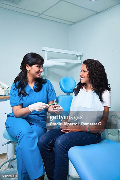 dentist training a patience - gloves clasped hands ストックフォトと画像