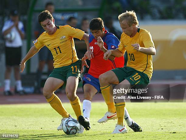 Cristian Gamboa of Costa Rica is tackled by Thomas Oar and Mitch Nichols of Australia during the FIFA U20 World Cup Group E match between Australia...