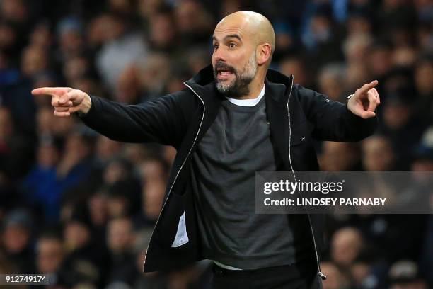 Manchester City's Spanish manager Pep Guardiola gestures on the touchline during the English Premier League football match between Manchester City...