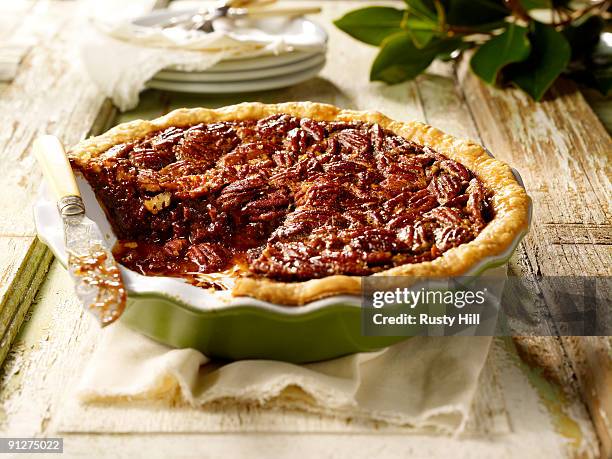 pecan pie with slice removed - pecan pie stock pictures, royalty-free photos & images