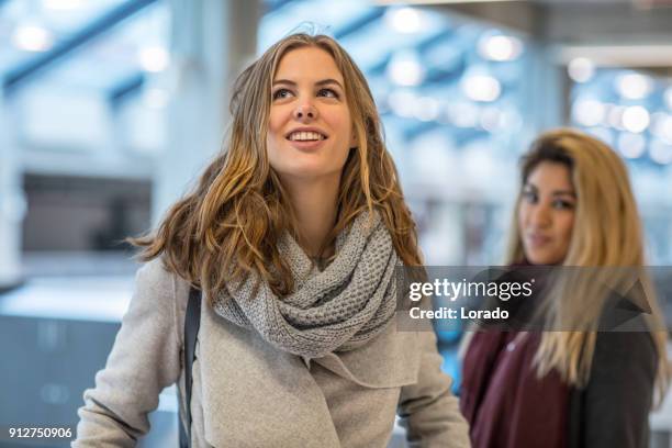 beautiful female university student on campus - linguistics stock pictures, royalty-free photos & images