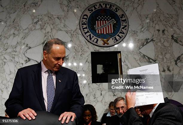 Committee Chairman Max Baucus talks with Sen. Chuck Schumer before a markup hearing of the Senate Finance Committee September 30, 2009 in Washington,...